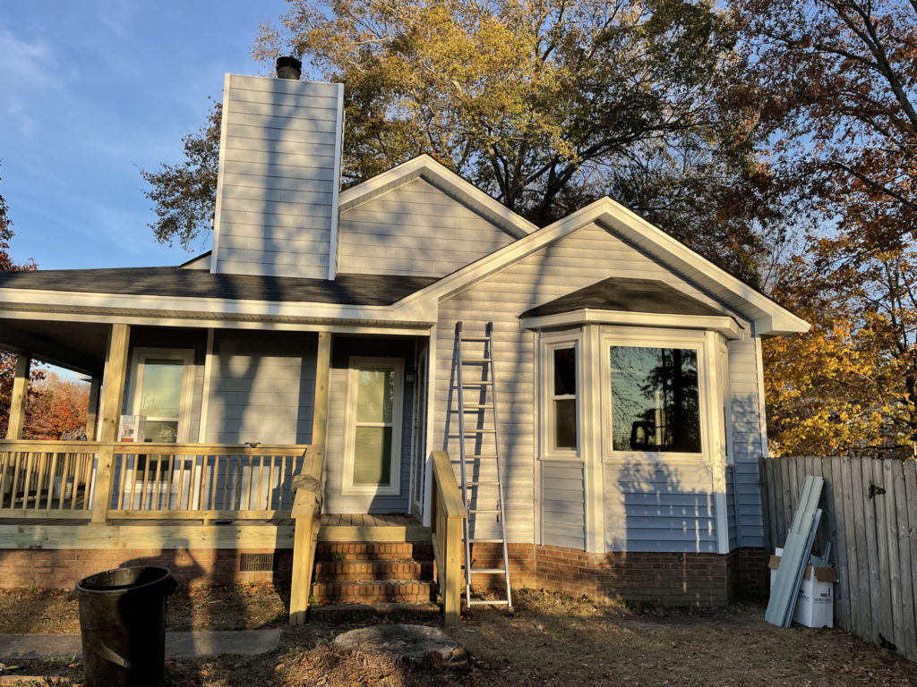 window and siding contractors near me replaced all of the siding for ranch home